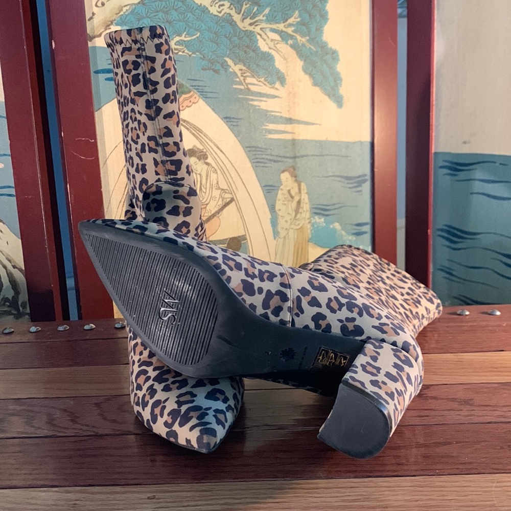 Size 7 Stuart Weitzman leopard boots with dust bag like new only worn one time.